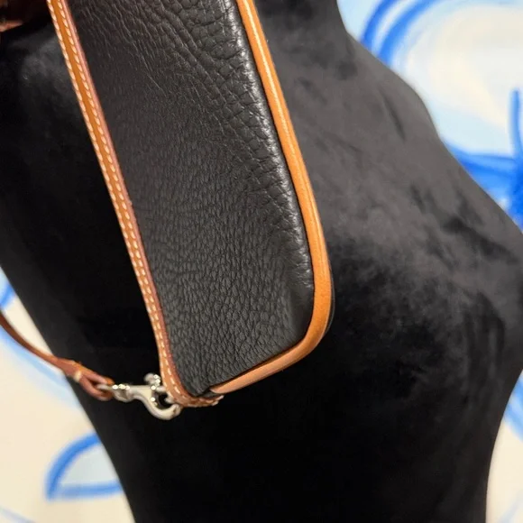 Dooney & Bourke Black and Tan Pebbled Leather Wristlet with Tassel - Picture 3 of 5